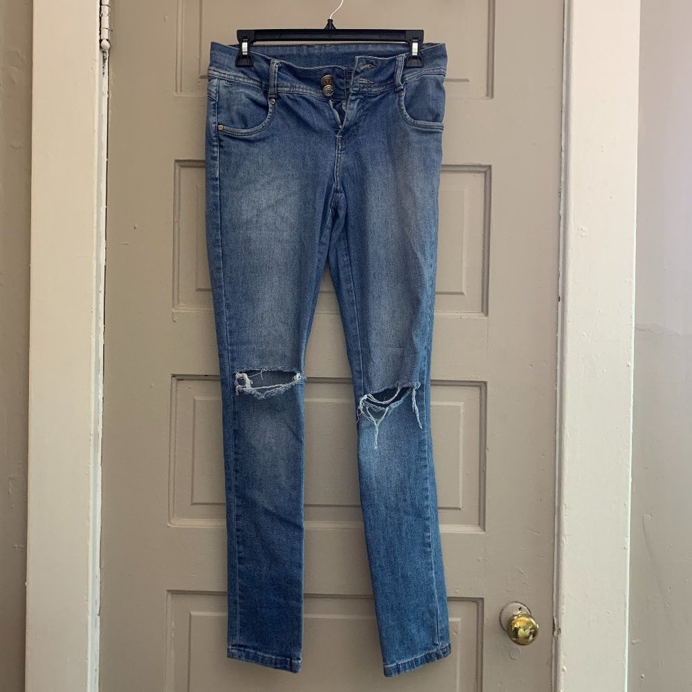 Blue distressed skinny jeans